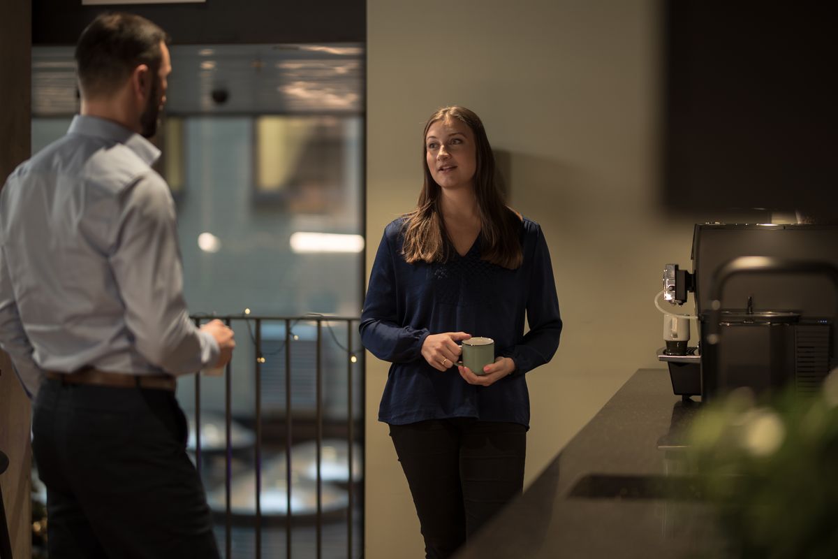 Team members chatting at the office